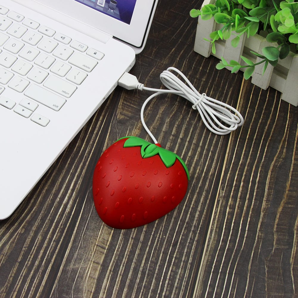 Wired Strawberry Computer Mouse plugged into a laptop, highlighting its vibrant colour and playful style for tech enthusiasts.