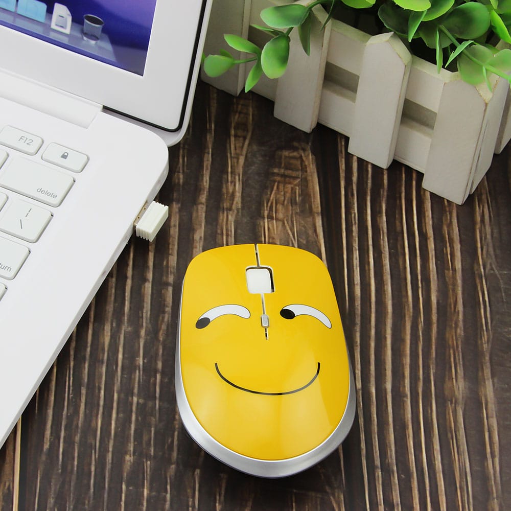 Wireless Emoji Computer Mouse with 1200 DPI on a desk, ideal for personalising your workspace.